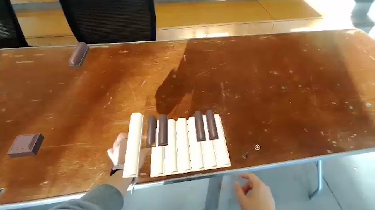 Tapping the chocolate keyboard keys to trigger sound in AR