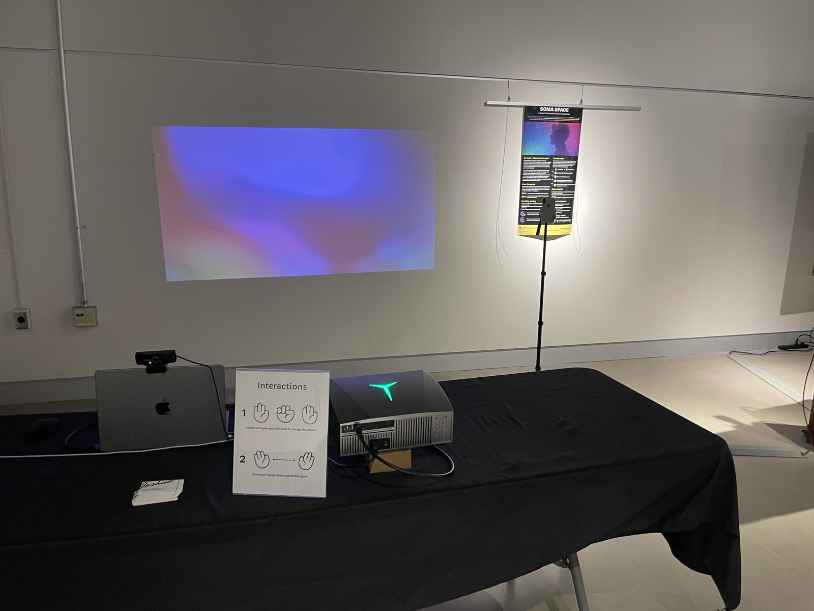 The SomaSpace installation: projector, laptop, and the visual on the wall